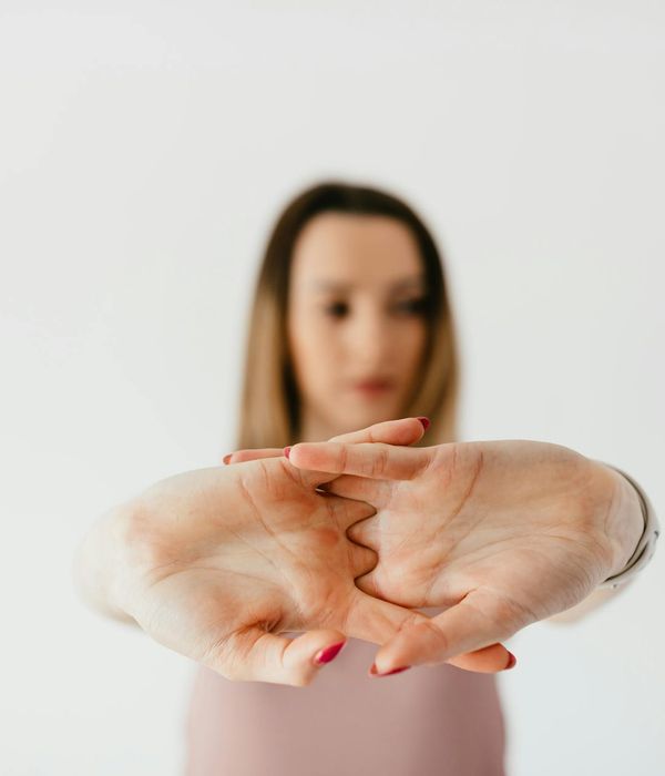 Woman in a calm yoga pose, embodying gentle movement and tranquility.